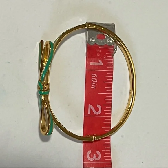 Kate Spade Gold Tone Bracelet with Green Bow NWOT with jewelry pouch - Picture 10 of 10